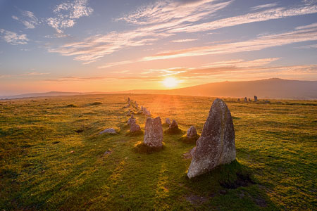 Sunset casting long shadows over the ancient Merrivale stone rows, Dartmoor